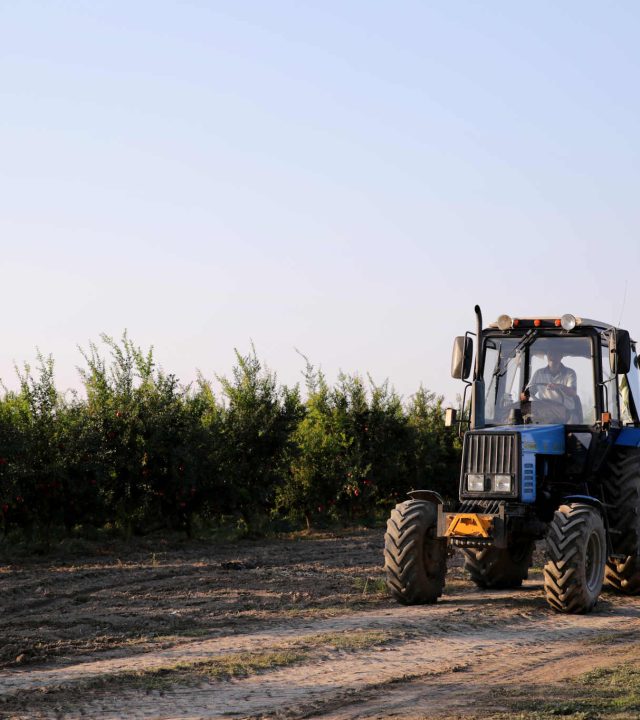 man-driving-tractor-through-field_Easy-Resize.com